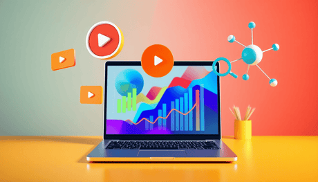 Modern workspace with laptop showing colorful graphs, surrounded by floating 3D icons of play buttons, magnifying glasses, and interconnected nodes in bright co